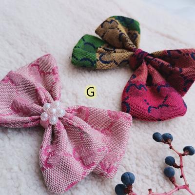 China Viable Cute Luxury Brand Decoration Accessories Pet Design Dog Hairpin Classic Bowknot for sale