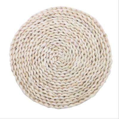 China Viable Wicker Mat Heat Insulation Holder Hand Woven Place Mats Rattan Cup Coasters Dining Table Linen Drink Coaster for sale