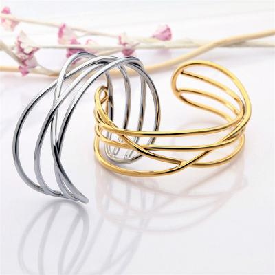 China Environmentally Friendly Customizable Stainless Steel Bangles Special Gold Twisted Couple Bracelet for sale