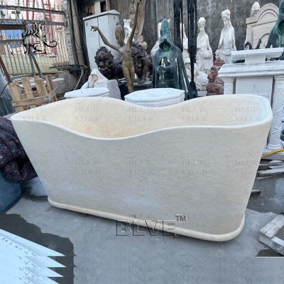 China Freestanding Marble Bathtub Cream Natural Stone Elegant Bathtub Hotel Luxury European Style Decorative for sale