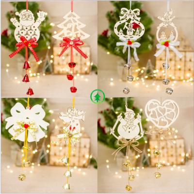 China Christmas Handwork Wooden Hollow Carving Christmas Bell Europe Christmas Tree Wood Pendant for sale