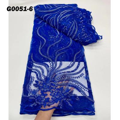 China Latest 2021 Sustainable Lace Dress Fabric Luxury Wedding Tulle Sequince Beaded Lace Fabric for sale