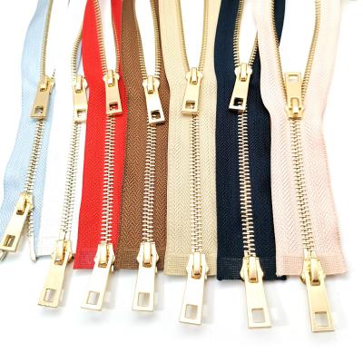 China Chinese Auto Lock Tender Double Sliders Can Be Sustained Use Customized Gold Zipper Used For Clothing for sale