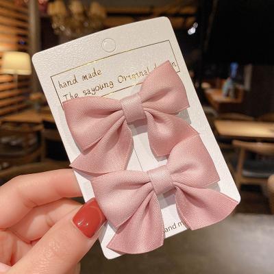 China Children Soft Grosgrain Hair Accessories Small Solid Hair Bow With Clips for sale