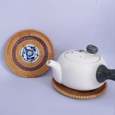 China 100% Sustainable Handwork Rattan Braided Bowl Pad Hollow Coaster With Porcelain Decoration for sale