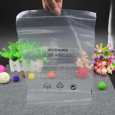 China 100 Pcs Disposable Lots Self Adhesive Resealable Clear Plastic Bags With Warning Words Clothes Gift Packaging Thick Sealing Bag 