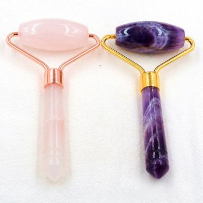 China Single Head Single Crystal Rose Beauty Purple Eye Facial Pink Quartz Jade Massager Amethyst Face Roller for sale