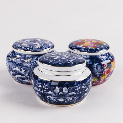 China Viable Ceramic Porcelain Tea Cart Mini Tea Caddy And Tea Canister for sale