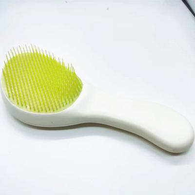 China Waterproof Plastic Cave Shape Detangling Hair Comb Brush for sale