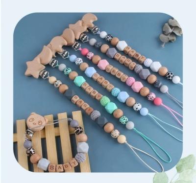 China BPA Free Wholesale Chewable Baby Wooden Bead Pacifier Clips Silicone Baby Pacifier Dummy Chain for sale