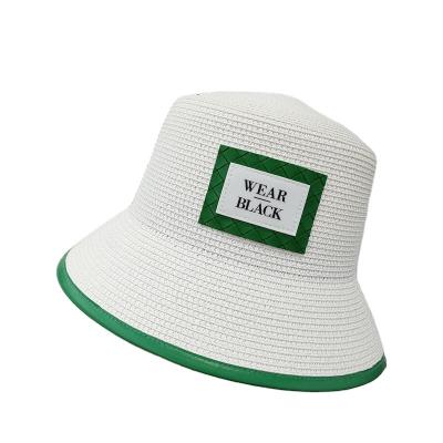 China Stylish Hand Striped - Woven Foldable Green Bucker Straw Hat Sun Visor Summer Beach Wide Brim Letter Hat For Women for sale