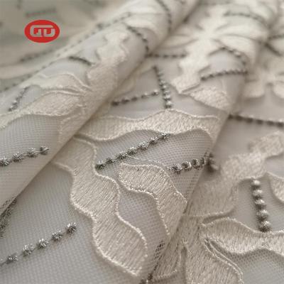 China Viable Cheap Manufacture White Embroidered Mesh Fabric Ladies Dress With Silver Thread for sale