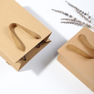 China Wholesale Recycled Materials Factory LOGO Handle Brown Paper Kraft Paper Customized Bag With Handles for sale