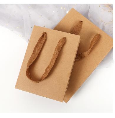 China Wholesale Customized Recycled Materials Factory LOGO Handle Kraft Paper Bag Brown White Brown White Handle for sale