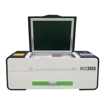 China Traceability 3050 4060 70w 90w mini CO2 laser engraving&cutting machine / mini type laser machine for sale