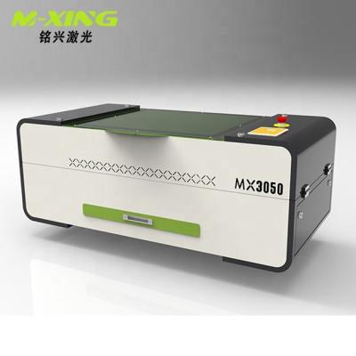 China Traceability MingXing Mini Laser 3050 CO2 4060 Laser Engraving Machine CNC Laser Wood Cutting Machine Mini for sale