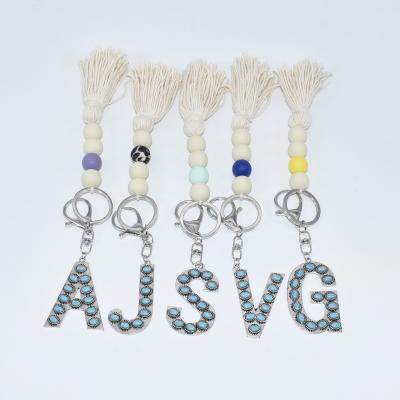 China New Suvenir Gift Wofish Design Navajo Silicone Beads Vintage Initial Turquoise Key Chain With Cotton Tassel for sale