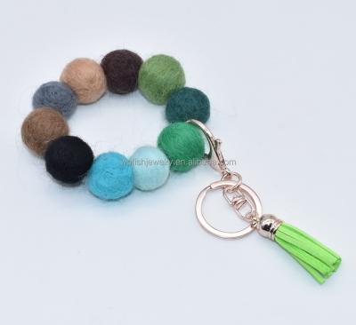 China Fasion Ball Bead Bracelet Multi Colors Felt Suede Tassel Essential Oil Car Diffuser Keychains for sale