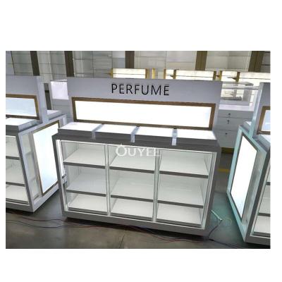 China Perfume Shop Furniture Corner Showcase Retail Store Decorations Stand Interior Design Perfume Shop Display Cabinet for sale