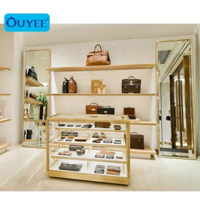 China Interior Design Luxury Gold Shop Stainless Handbag Bags And Wallet Show Case Glass Display Furniture Bags Display Showcase for sale