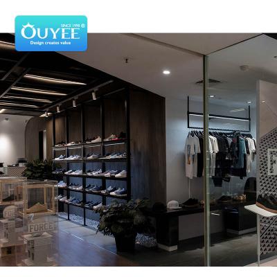 China Creative retail store clothing display rack sports shop design store display shoes shop counter design for sale