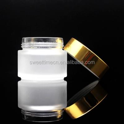 China Empty personal care glass jars with gold cap for face cream in stock for sale