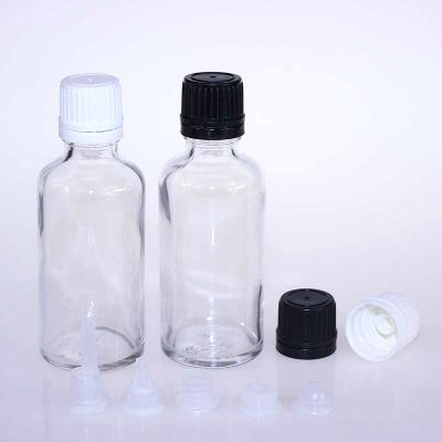 China Personal Care Flint Color 50ml Essential Oil Glass Bottle With Brush Glass Cosmetic Containers And Packaging for sale