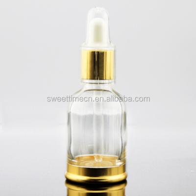 China Beautiful personal care essential oil dropper glass bottle with gold metal and aluminum base dropper for sale