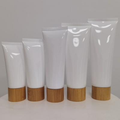 China 50g 60g 80g 100g 120g 150g cosmetic white color plastic cosmetic soft tube with bamboo screw cap for sale