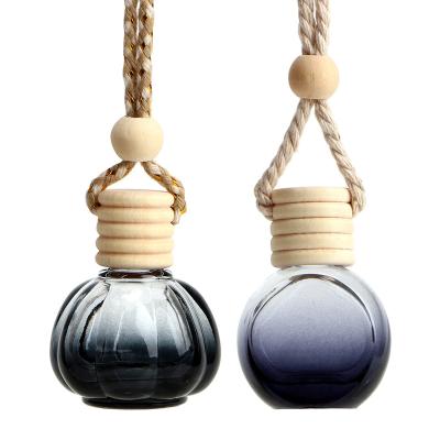 China Empty Black Round Glass Bottle 10ml Hang Bottle Car Glass Perfume Personal Care Bottle for sale