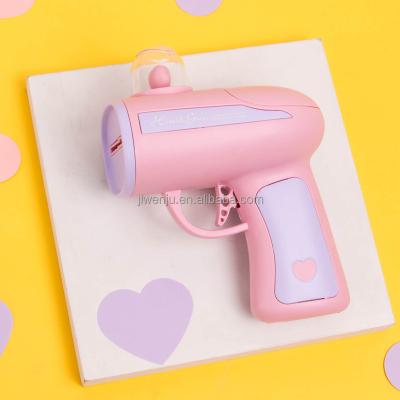 China Toy Gun Pink Heart Paper Spray Gun Toy Pink Plastic Paper Launcher Toy Guns for sale