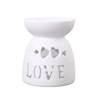 China No Design Clay Ceramic Oil Burner Love Essential Oil Burner For Home Decorative for sale