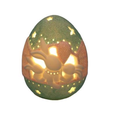 China Cheap Decoration QLAC Ceramic Easter Egg With LED Light For Decoration for sale