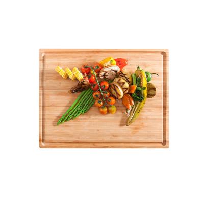 China Sustainable extra large and strong reversible cutting board with groove bamboo cutting board for sale