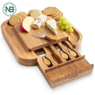 China Sustainable 100% Organic Cheese Cutting Board and Knife Set Bamboo Cheese Board with Slide-Out Drawer for sale