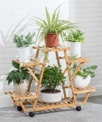 China Convertible 4 Tiers Bamboo Natural Wooden Flower Pot Rack Plant Stand Corner Shelf With Wheel for sale