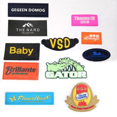 China Eco-friendly Customized Embossed Logo Low MOQ 3D Soft PVC Silicon Soft Rubber Patches For Garments for sale