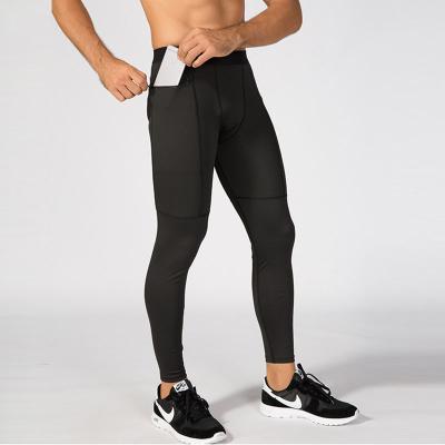 China PRO Fitness Breathable Tight Pants Men Sports Running High Elastic Quick Dry Tight Pants Sweat With Zipper Pocket for sale