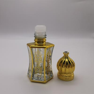 China Plating Cosmetic UV Gold Perfume Silver Decorative Oil Bottle With Plastic Stick And Diamond Crown Perfume Bottle Cap for sale