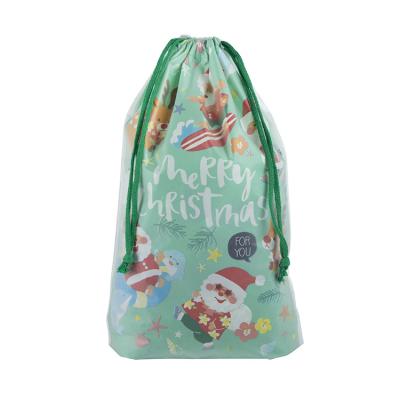 China Recycled Plastic Biodegradable Transparent Christmas Materials PVC Dust Bag Pull Rope Christmas Candy Gift Bag for sale