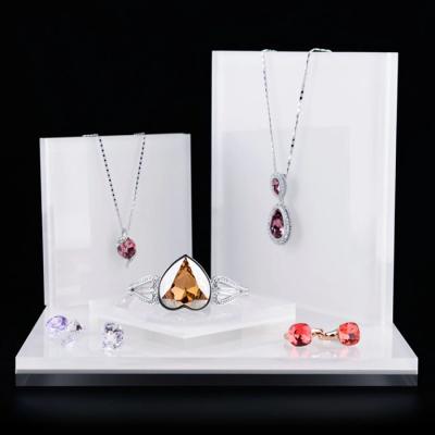 China Eco-friendly Luxury White Acrylic Jewelry Display Stand Set For Ring Earring Necklace Bracelet Exhibitor Stand Jewelry for sale