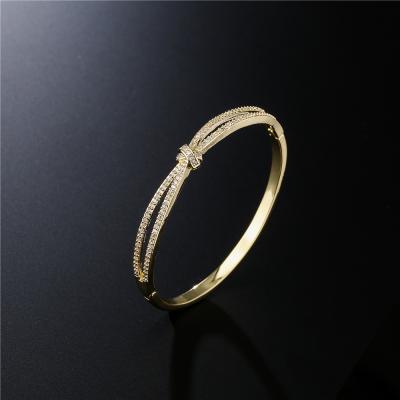 China Wholesale Custom Trendy Fashion Jewelry SL-AG024 Gold Plated Cubic Zirconia Arc-knot Bangle Bracelet For Women for sale