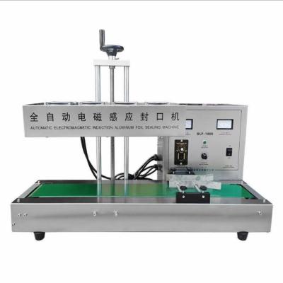 China Automatic Food Sealing Machine for Plastic Bottle Film Bottle Aluminum Foil Sealing Machine for sale