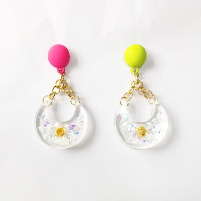 China Trendy Shiny Gold Plated Clear Dried Flower Earrings Moon Dangle Earrings for sale