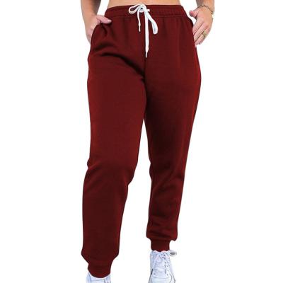 China New QUICK DRY women's solid color sports lace-up pants home leisure and thick sweater pants for sale