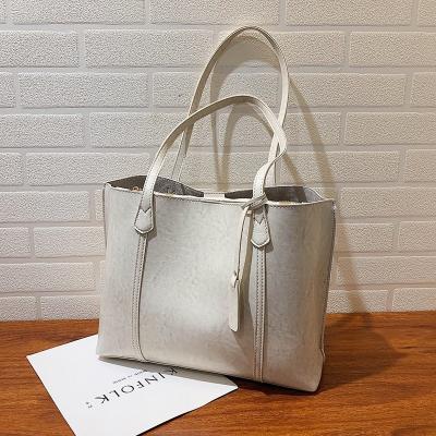 China Normcore/Minimalist Leather Fashion Vegan Large Capacity High Quality Handbag For Ladies Shoulder Tote Bag Of Women for sale