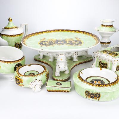 China Sustainable Luxury Ceramic KTV/BAR/CLUB Porcelain Gold Foot Fruit Plate High Dishes With Base Support for sale