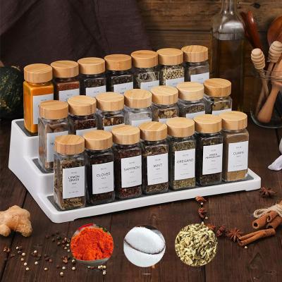 China Viable Wholesale Custom Organizer Bulk 24 Lid Wooden 44Mm Square Salt Spice Glass Jars Set For Kitchen Drawers for sale