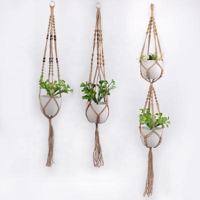 China Bohemian Style Vintage Look Garden Decor Jute Rope Plant Rack Macrame Plant Hangers for sale