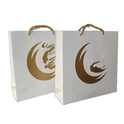 China Modern wholesale custom paper bag with handle paper bag for gift custom logo gift bag for sale